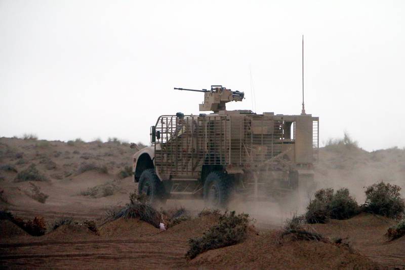 An armoured vehicle takes part in military operations.