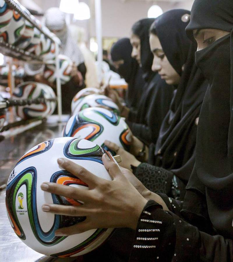 Employees conduct a final check to fix any cavities in the seams of balls inside the football factory that produces official match balls for the 2014 World Cup in Brazil, in Sialkot, Punjab province on May 16, 2014. It was when he felt the roar of the crowd at the 2006 World Cup in Germany that Pakistani factory owner Khawaja Akhtar first dreamt up a goal of his own: to manufacture the ball for the biggest football tournament on the planet. Last year he finally got his chance - but only 33 days to make it happen. Sara Farid / Reuters