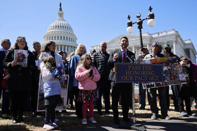 Congressman Raul Ruiz joins veterans, advocacy groups, activists, victims' families and fellow Democrats for a news conference about military burn pits legislation.  Getty Images / AFP
