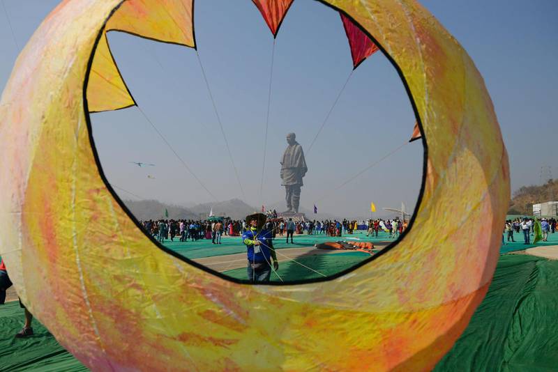 An Indian participant prepares to fly a kite during the 30th International Kite Festival near the site of the Statue Of Unity. AFP