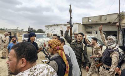 Fighters loyal to the Libyan internationally-recognised Government of National Accord (GNA) are pictured near the frontline during clashes against forces loyal to strongman Khalifa Haftar, on June 1, 2019, in al-Sawani area, south of the Libyan capital Tripoli. (Photo by Mahmud TURKIA / AFP)