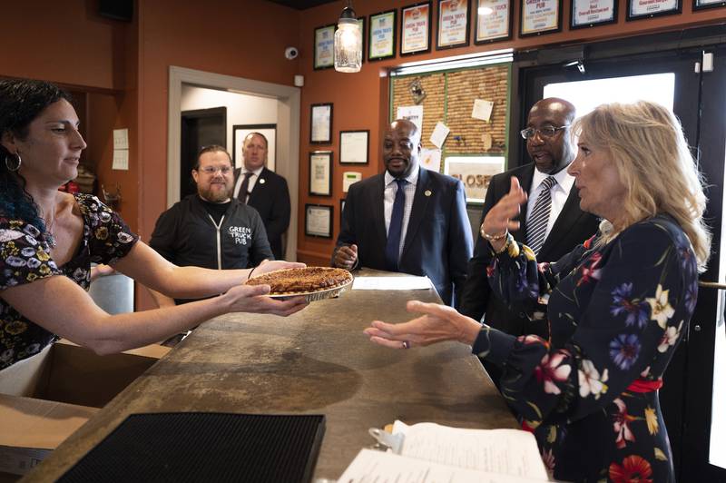 Ms Biden gets a pie to-go at Green Truck Neighbourhood Pub in Savannah with Mr Warnock. AP
