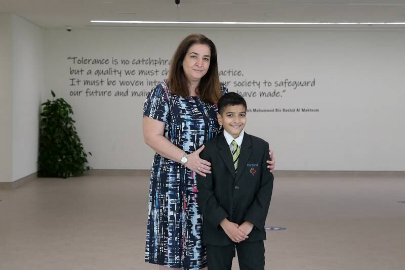 DUBAI, UNITED ARAB EMIRATES , March 9, 2021 –  Alex George with his mother Lalita at the Hartland International School in Dubai. Alex George, an 11-year-old pupil scored a 9 in IGCSE Mathematics. This is the highest score possible. Usually, children in year 11 (aged 15-16) sit for this exam, but Alex appeared for it four years in advance. Alex is in an accelerated programme at Hartland International School in Dubai. (Pawan Singh / The National) For News/Online. Story by Anam