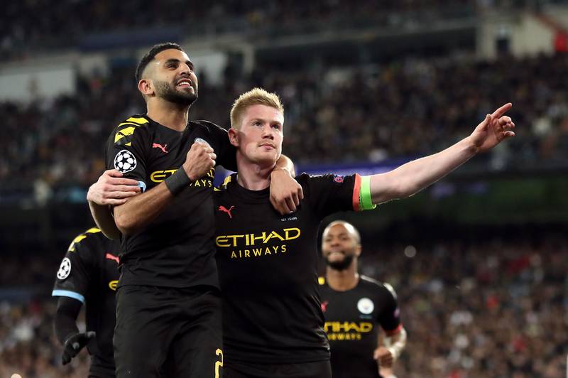 Manchester City's Kevin De Bruyne (right) celebrates scoring his side's second goal of the game with Riyad Mahrez during the UEFA Champions League round of 16 first leg match at the Santiago Bernabeu, Madrid. PA Photo. Picture date: Wednesday February 26, 2020. See PA story SOCCER Real Madrid. Photo credit should read: Nick Potts/PA Wire