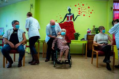 Josepha Delmotte, 102, receives a dose of the Pfizer-BioNTech Covid-19 vaccine at a care home in Mons, Belgium. AFP