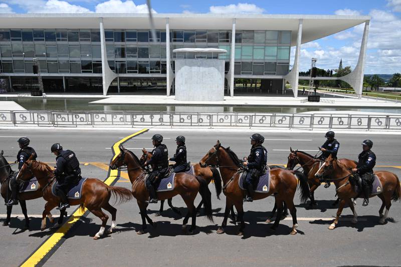 Mounted police patrol in front of the Planalto Palace in Brazil. AFP