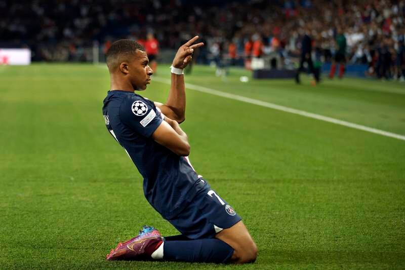 Kylian Mbappe celebrates after scoring his second. EPA
