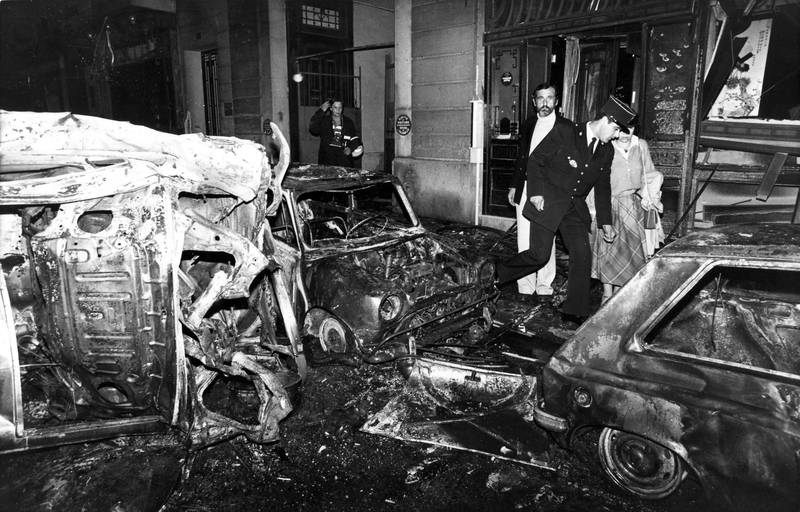 Destroyed vehicles and damaged buildings at the scene of the Copernic street synagogue in Paris on October 3, 1980. AP