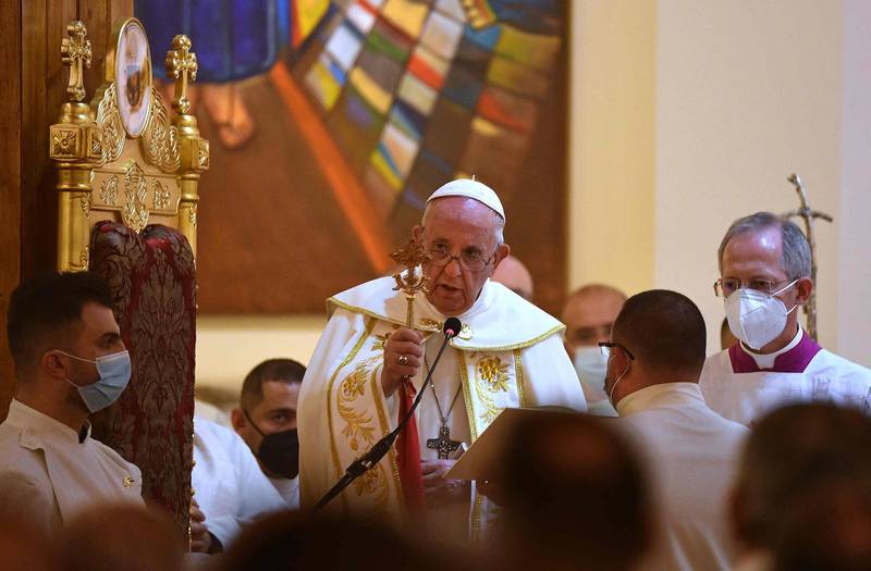 Pope Francis blesses the congregation as he leads mass at Baghdad's Saint Joseph Cathedral. AFP