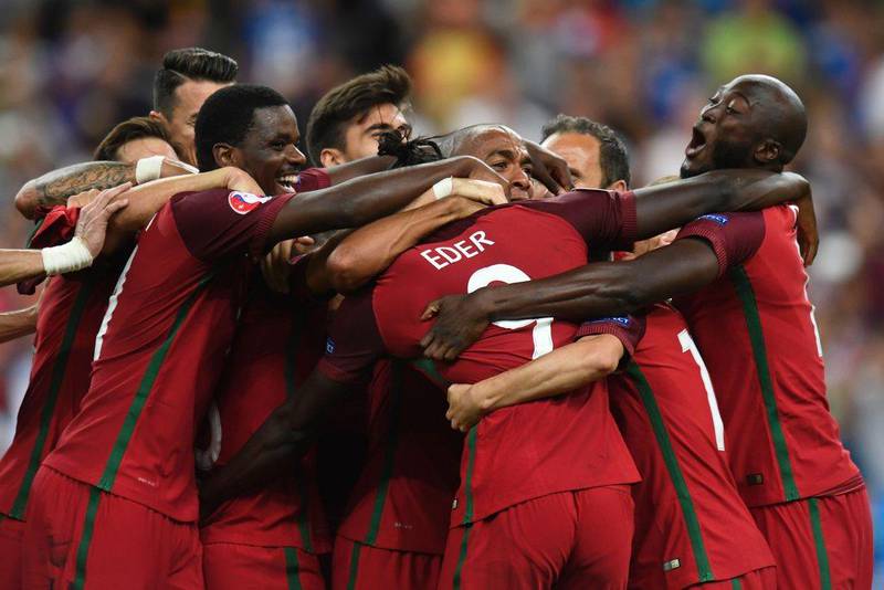 Portugal's players celebrate after they beat France during the Uefa Euro 2016 Final football match at the Stade de France in Saint-Denis, north of Paris, on July 10, 2016. Philippe Desmazes / AFP
