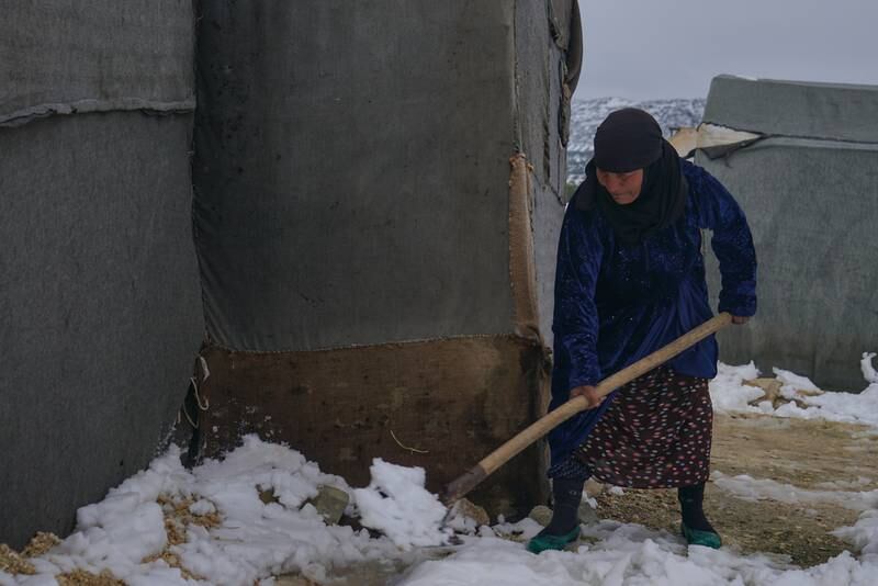 Jamila Al Hadi, 65, says 'when snow falls, our suffering increases even more, as the tents fall over our heads and we have to shovel the snow from the edges of the tents'