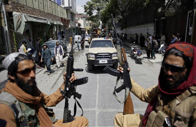 Taliban fighters patrol Kabul, Afghanistan on August 19, 2021. AP