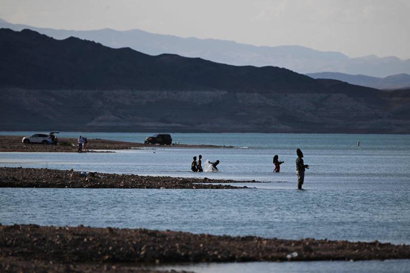 People fish and play in the water on Lake Mead. It is the largest reservoir in the US, a huge man-made body of water formed by the construction of the Hoover Dam in the early 1930s. AFP