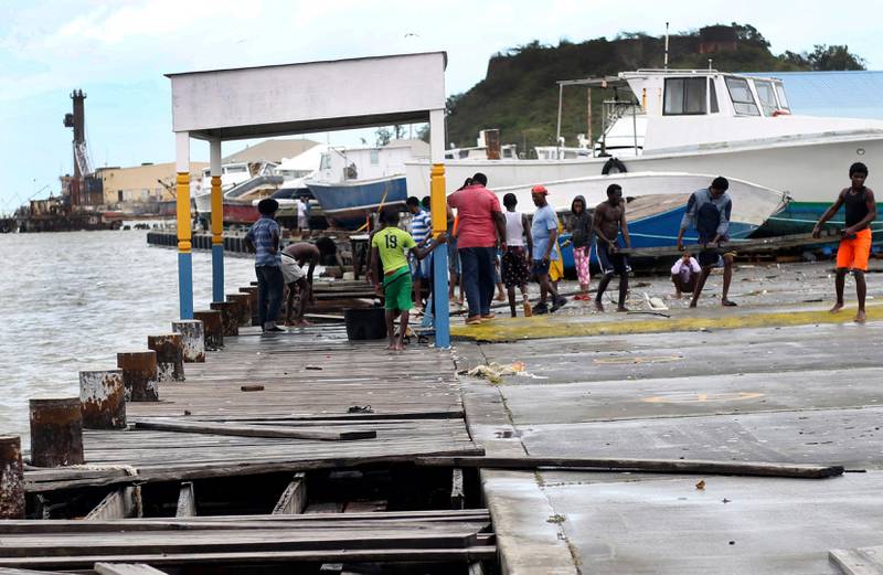 People recover broken parts of the dock after the passing of Hurricane Irma, in St. John's, Antigua. Johnny Jno-Baptiste / AP Photo