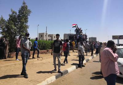 Sudanese demonstrators chant slogans outside the army headquarters in the capital Khartoum.  AFP