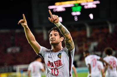 Tianjin Quanjian's Alexandre Pato (L) celebrates after scoring during the AFC Champions League round of 16 football match between China's Guangzhou Evergrande and Tianjin Quanjian in Guangzhou in China's southern Guangdong province on May 15, 2018. China OUT
 / AFP / -
