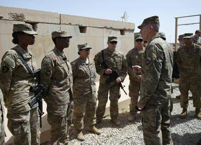 The US commander in Afghanistan John Nicholson (R) talks with soldiers ahead of a handover ceremony at Leatherneck Camp in Lashkar Gah in the Afghan province of Helmand on April 29, 2017.
US Marines returned to Afghanistan's volatile Helmand April 29, where American troops faced heated fighting until NATO's combat mission ended in 2014, as embattled Afghan security forces struggle to beat back the resurgent Taliban. The deployment of some 300 Marines to the poppy-growing southern province came one day after the militants announced the launch of their "spring offensive", and as the Trump administration seeks to craft a new strategy in Afghanistan. / AFP PHOTO / WAKIL KOHSAR