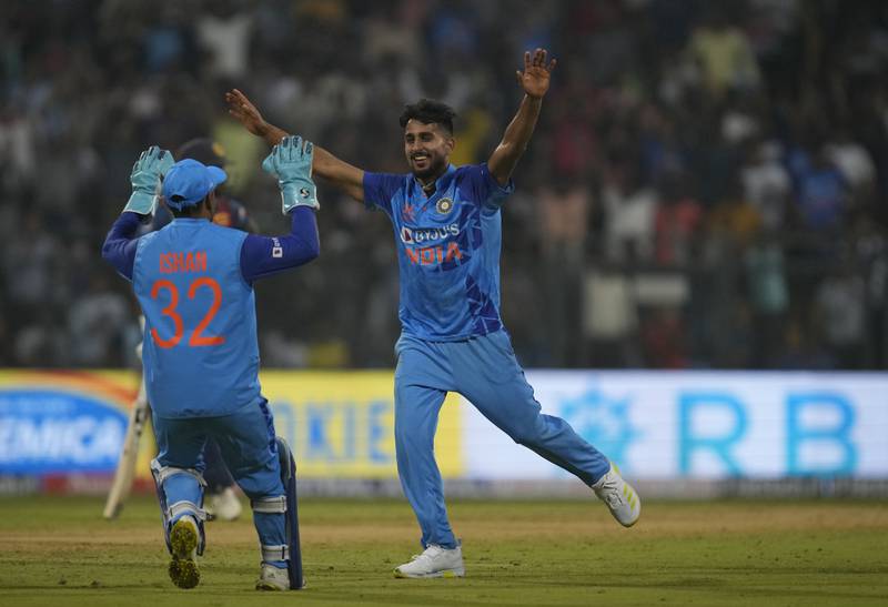 India's Umran Malik celebrates the wicket of Dasun Shanaka during the first T20 in Mumbai. Malik bowled at a top speed to 155kph in India's win on Tuesday. AP