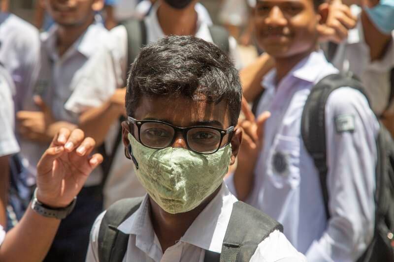 A school pupil wearing a face mask attends school as a surge of Covid-19 cases hit Dhaka, Bangladesh, in 2022. EPA