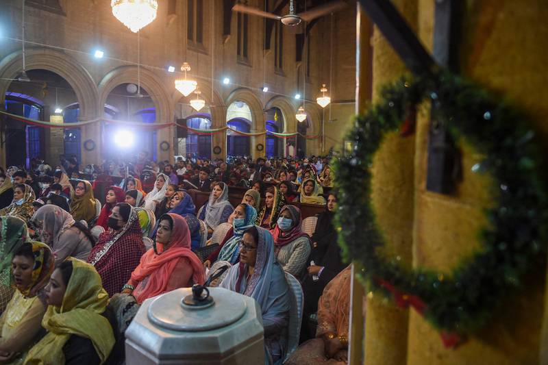 People attend a Christmas service at Saint Andrew's Church in Karachi. AFP