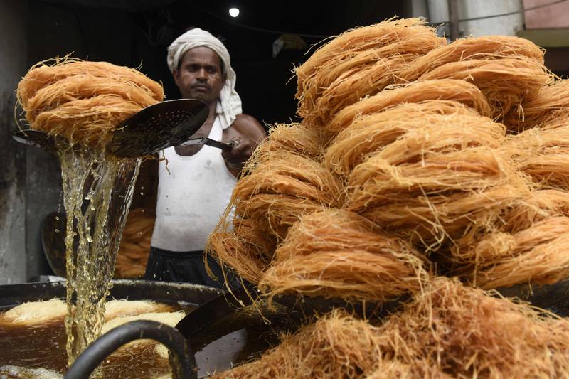 Vermicelli is cooked at a stall in Amritsar, India, before the Karva Chauth festival, in which married women fast a whole day and offer prayers to the Moon for the welfare, prosperity, and longevity of their husbands. AFP