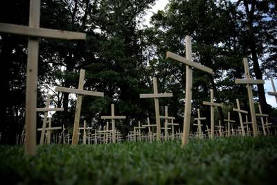 Crosses are seen outside a church in Baton Rouge, Louisiana.  Each cross represents one life lost to coronavirus in the state. Reuters