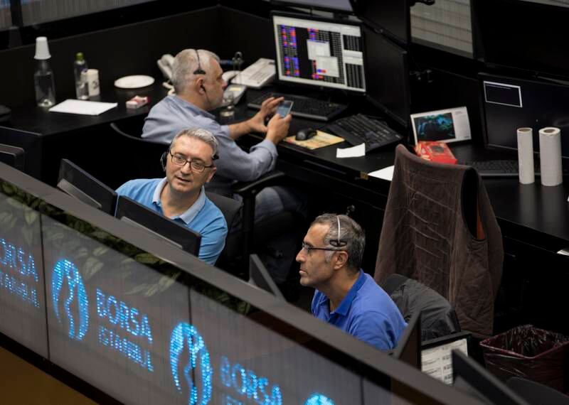 epa06940373 Turkish traders work during the morning session at the Borsa Istanbul Stock Exchange in Istanbul, Turkey, 16 August 2018. Turkish and global stocks fell on 10 August because of fears of ongoing financial instability in Turkey. The Turkish currency had plunged by almost 30 percent against the US dollar since the end of last year.  EPA/SEDAT SUNA