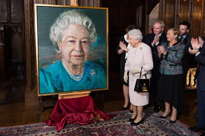 Queen Elizabeth unveils a portrait of herself by artist Colin Davidson at Crosby Hall, London, in 2016. Getty Images