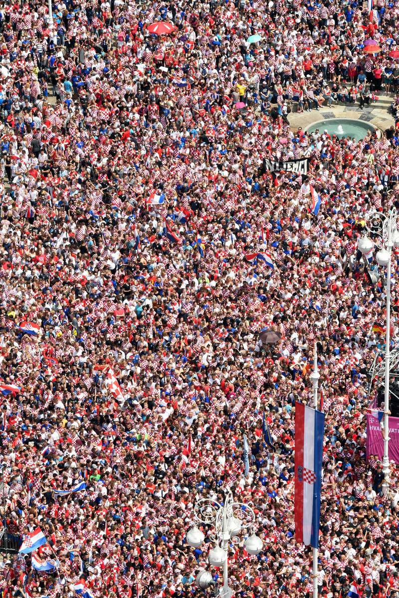 People gather for a 'heroes' welcome' in tribute to the Croatian national football team at the Bana Jelacica Square in Zagreb. Denis Lovrovic / AFP
