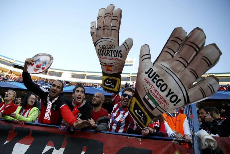 Atletico Madrid fans cheer prior to the Champions League semi-final first leg match against Chelsea on Tuesday. Paul Hanna / Reuters / April 22, 2014