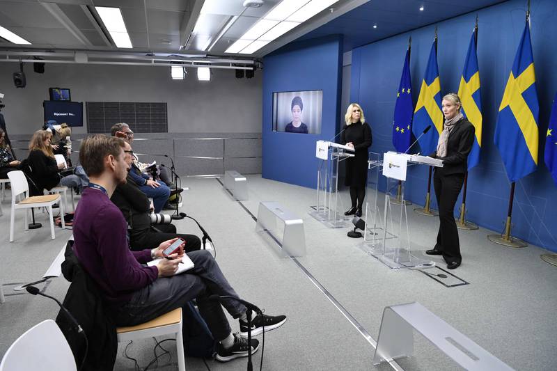 Ministers in Sweden attend a press conference on the new coronavirus restrictions, in Stockholm. Sweden will introduce Covid-19 vaccine passes for public events with more than 100 people. AFP