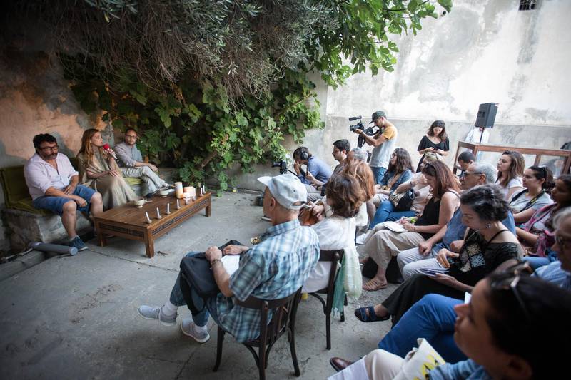 <p>A conversation among Hedi Khelil, Khadija Hamdi-Soussi and Yazid Oulab&nbsp;in the &quot;earth&quot; pavilion, sited in the Mausoleum Sidi&nbsp;Boukhrissane in Tunis</p>
