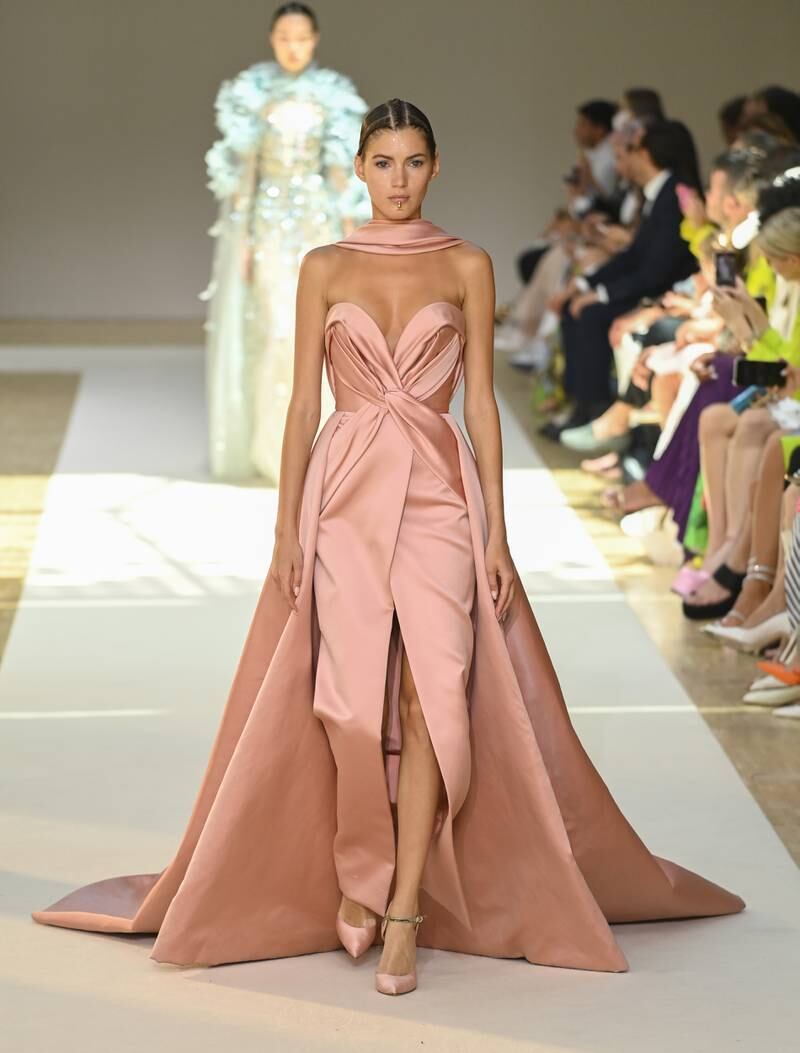 An elegant nude satin gown. Getty