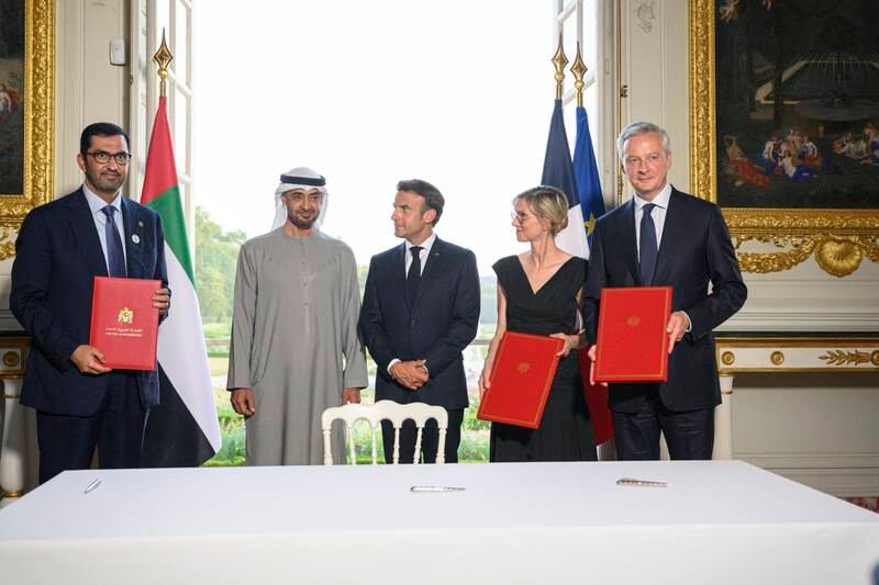President Sheikh Mohamed and French President Emmanuel Macron with Dr Sultan Al Jaber, UAE Minister of Industry and Advanced Technology, managing director and group chief executive of Adnoc and chairman of Masdar, left, French Minister for Energy Transition Agnes Pannier-Runacher, second right, and French Finance Minister Bruno Le Maire. Photo: Presidential Court