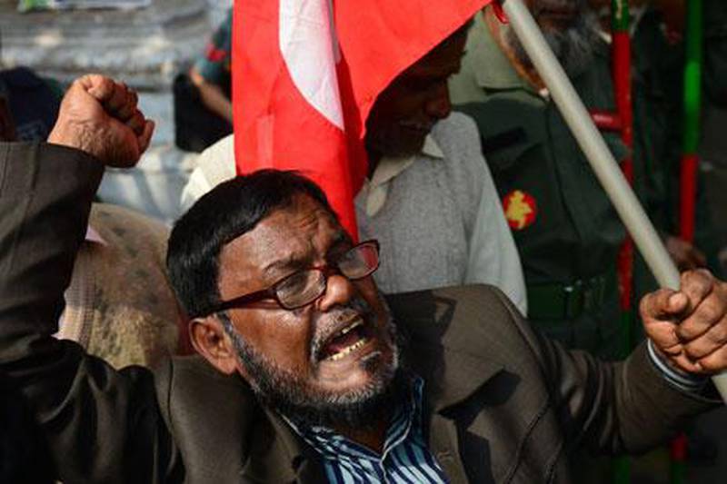 Former freedom fighters protest outside the International Crimes Tribunal in Dhaka on Monday. Munir uz Zaman / AFP