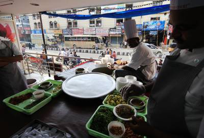 HYDERABAD - INDIA - 02AUG 2012 -  Customers buying Haleem at Paradise Food Court in Secunderabad, haleem, a dish of meat and lentils that it makes particularly during Ramadan in Andhra Pradesh State in India. Ravindranath K / The National (to go with Samanth story on Ramadan)