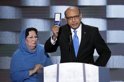 Khizr Khan, father of fallen US Army Capt Humayun Khan, holds up a copy of the Constitution of the United States during the final day of the Democratic National Convention in Philadelphia. AP