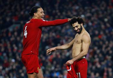 Mohamed Salah celebrates with Virjil van Dijk after scoring the second goal against Manchester United, the latest win in Liverpool's incredible run. Reuters