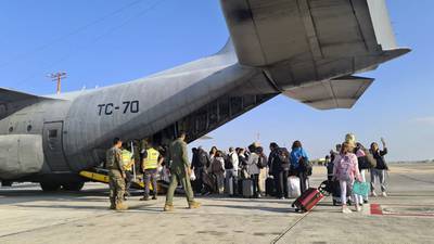 Argentine citizens boarding a C-130 Hercules aircraft at Ben Gurion International Airport in Tel Aviv. AFP