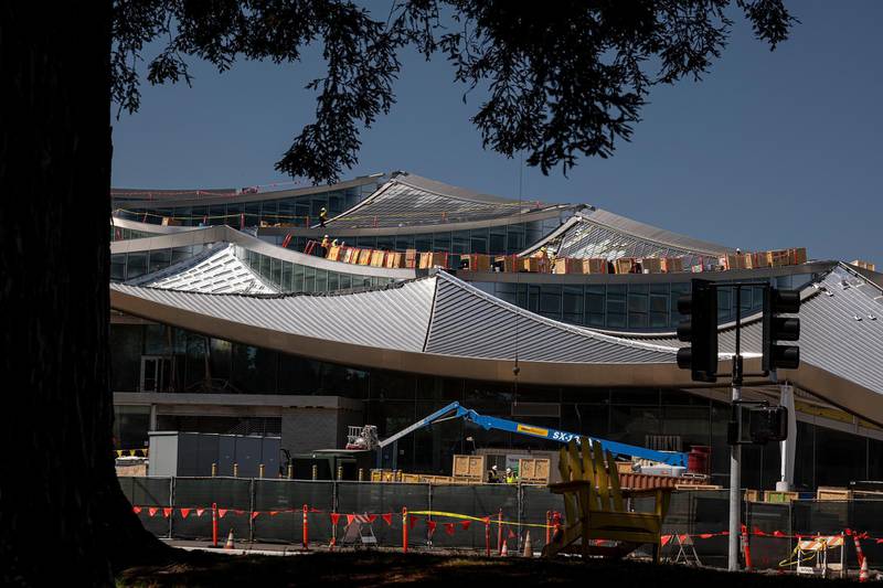 Workers stand on a roof of a building under construction the Google campus in Mountain View,  California, U.S., on Wednesday, April 21, 2021. Silicon Valley has the lowest office vacancy rate in the U.S., even as technology companies embrace remote work. Photographer: David Paul Morris/Bloomberg