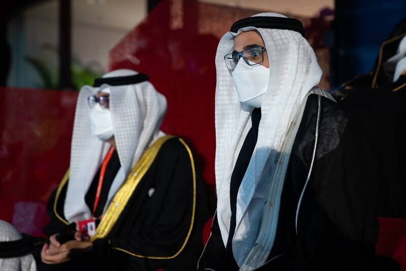 Sheikh Khaled bin Mohamed, Member of the Abu Dhabi Executive Council and Chairman of Abu Dhabi Executive Office, right, attends the opening ceremony of the 2022 Beijing Winter Olympics.
