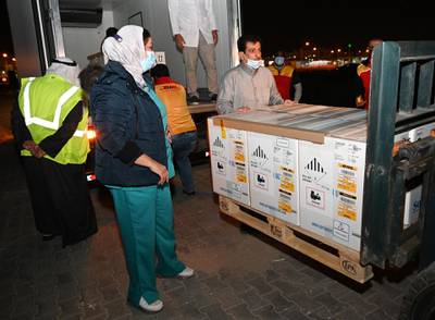 The first shipment of the Covid-19 vaccine arrives at Kuwait International Airport in Farwaniya, Kuwait. Kuwait's health minister Basel Al-Sabah announced that the vaccine would be given out in four stages, with the first stage including healthcare professionals, frontline workers and people over the age of 65. EPA