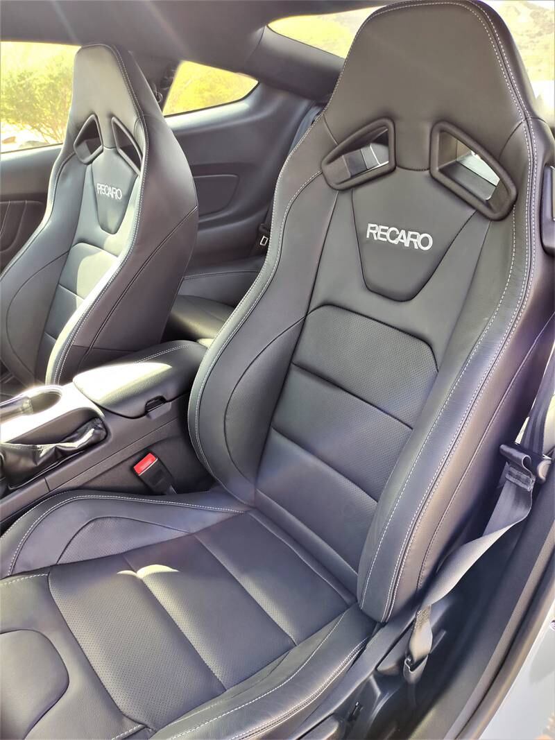 The cabin features leather sports seats with stitching in Metal Grey.