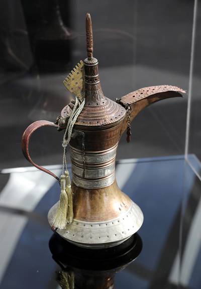 ABU DHABI , UNITED ARAB EMIRATES , JAN 27 – 2018 :- Dallah used in the Emirates of Abu Dhabi in the early 20th century ( Al Hosn ) on display during the Majlis Zayed Exhibition held at the 90th floor of Burj Mohammed bin Rashid in Abu Dhabi. The rare personal belongings used by the late Sheikh Zayed Bin Sultan Al Nahyan on display at the exhibition.  (Pawan Singh / The National) For News. 