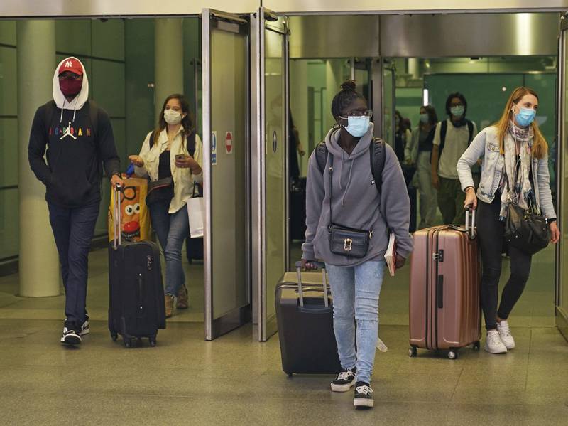 Travellers arrive from France on a Eurostar train at St Pancras International railway station in London.