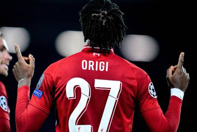 Divock Origi celebrates after scoring the fourth goal, sending Liverpool to the Champions League final.  EPA