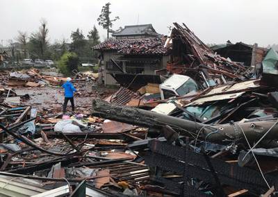 A man walks through debris of damaged houses by a tornado caused by typhoon Hagibis in Ichihara, Chiba Prefecture, east of Tokyo. EPA