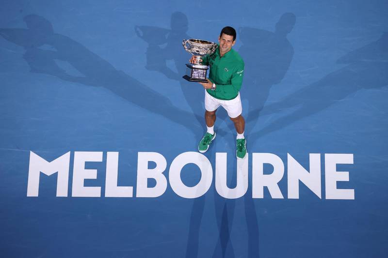 Novak Djokovic holds the Norman Brooks Challenge Cup after beating Dominic Thiem in the Australian Open final on Sunday. AFP