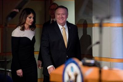 Secretary of State Mike Pompeo, right, accompanied by State Department spokeswoman Morgan Ortagus arrives for a news conference at the State Department in Washington. AP Photo