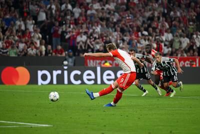 Harry Kane of Bayern Munich scores their third goal from the penalty spot. Getty 